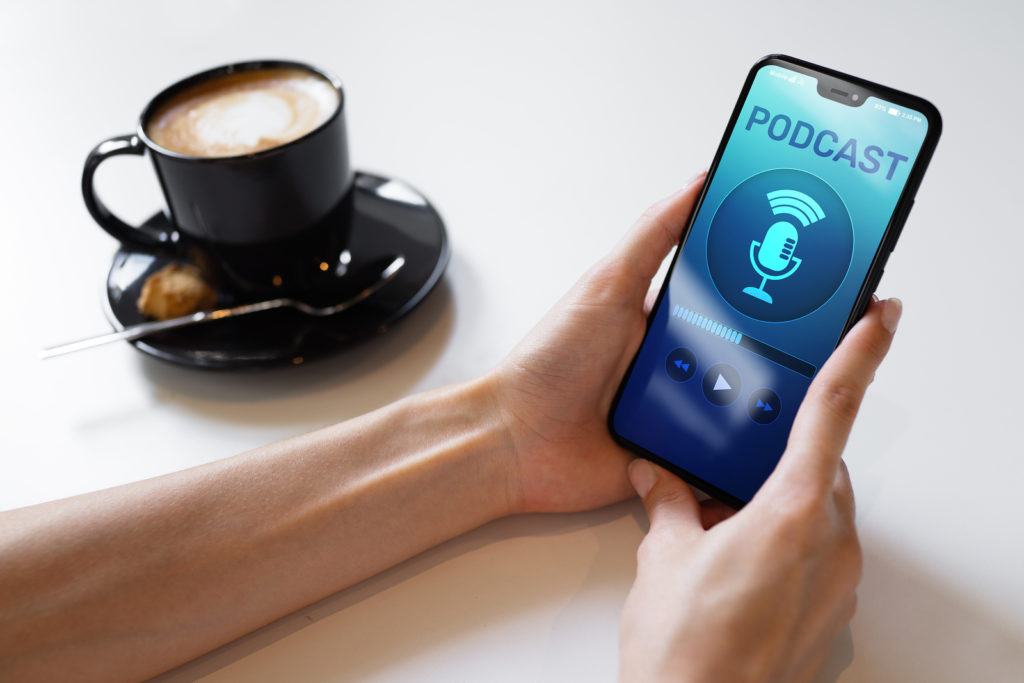 Podcast playing or recording application on mobile phone screen. Internet radio media concept. Podcast playing or recording application on mobile phone screen. Internet radio media concept.