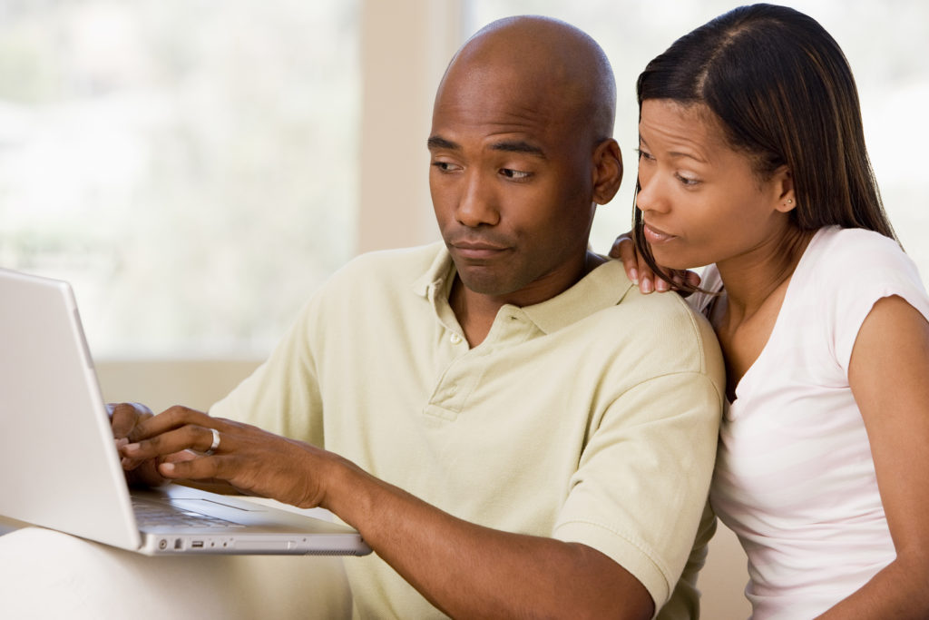 FlexJobs Warns of 12 Common Work-at-Home Job Scams and Offers Job Seekers Key Tips to Stay Safe bigstock Couples In Living Room Using L 4137392 1 1024x683 - FlexJobs Warns of 12 Common Work-at-Home Job Scams and Offers Job Seekers Key Tips to Stay Safe