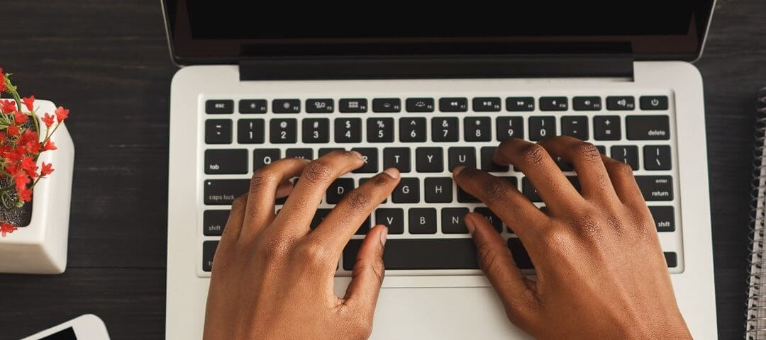 Woman typing on laptop